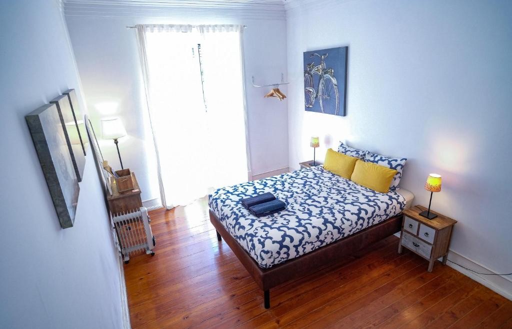 Bright Lisbonera Guest House room with traditional wooden floors